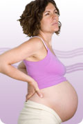 Understanding back pain during pregnancy : photo of pregnant woman with back pain.