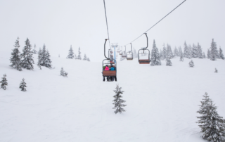 skiers on ski lift
